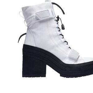 Converse White and Black Lace Up Boots The Converse Logo Is In Yellow Writing
